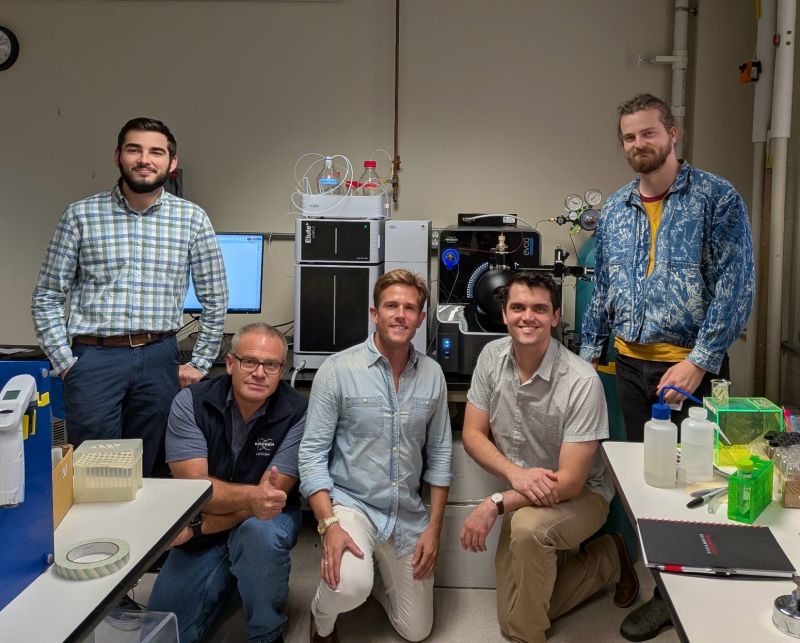 The Quantera team and Bruker staff in the lab beside the new instrument.